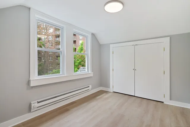 a view of a room that has a window in it