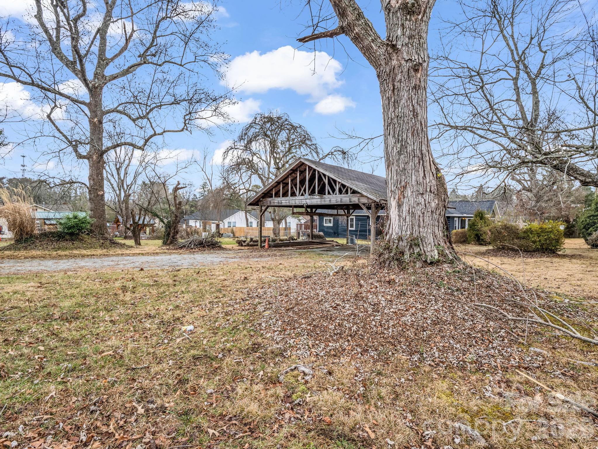 0 Ray Avenue Hendersonville, NC 28792 - Photo 3 of 18 a house with trees in front of it
