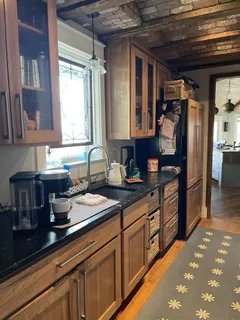a kitchen with sink and cabinets