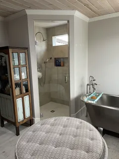 a bathroom with a tub and a shower