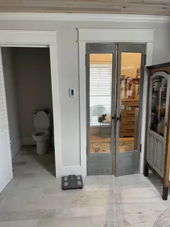 a view of entryway with a tub and shower