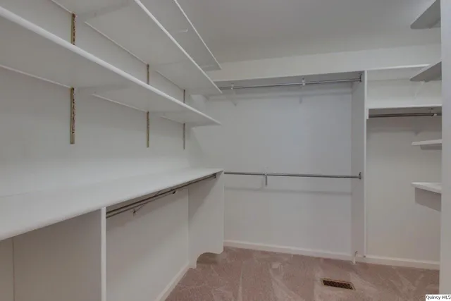 a view of an empty walk in closet