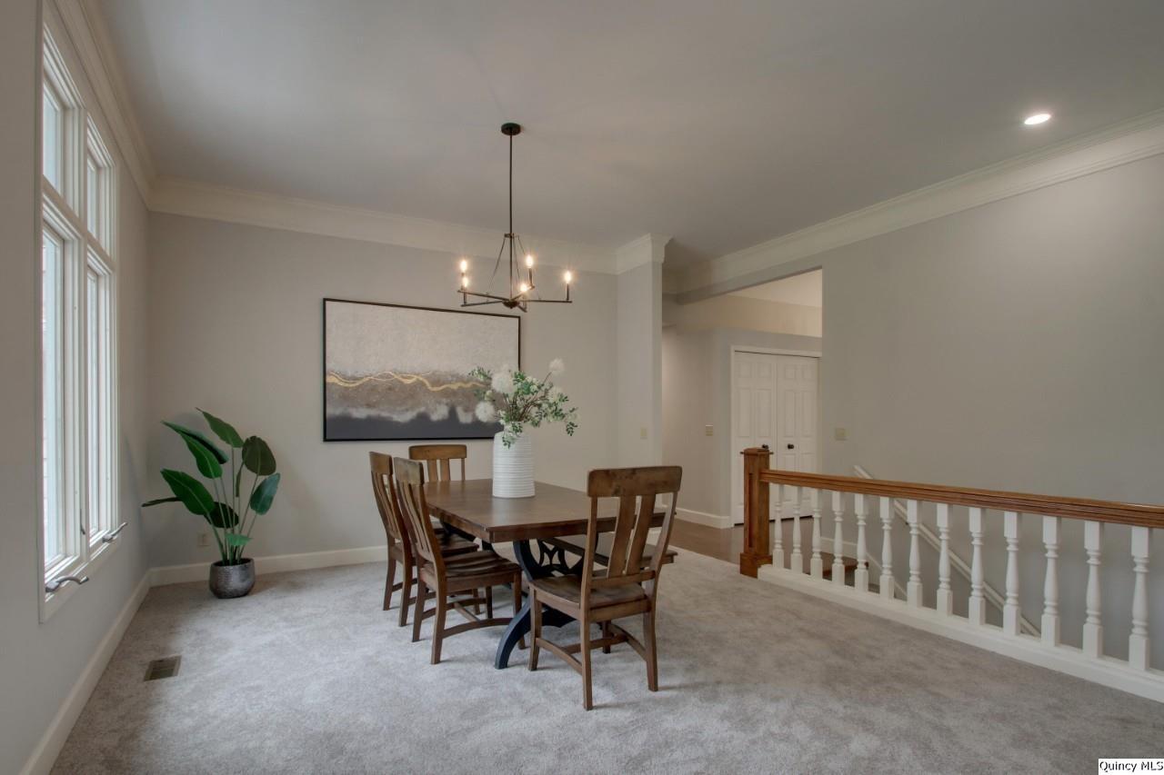 3510 Overlook Drive Quincy, IL 62305 - Photo 9 of 29 a view of a dining room with furniture window and wooden floor