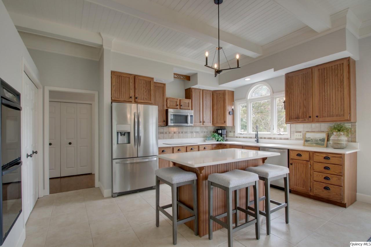 3510 Overlook Drive Quincy, IL 62305 - Photo 10 of 29 a kitchen with stainless steel appliances granite countertop a center island and a refrigerator