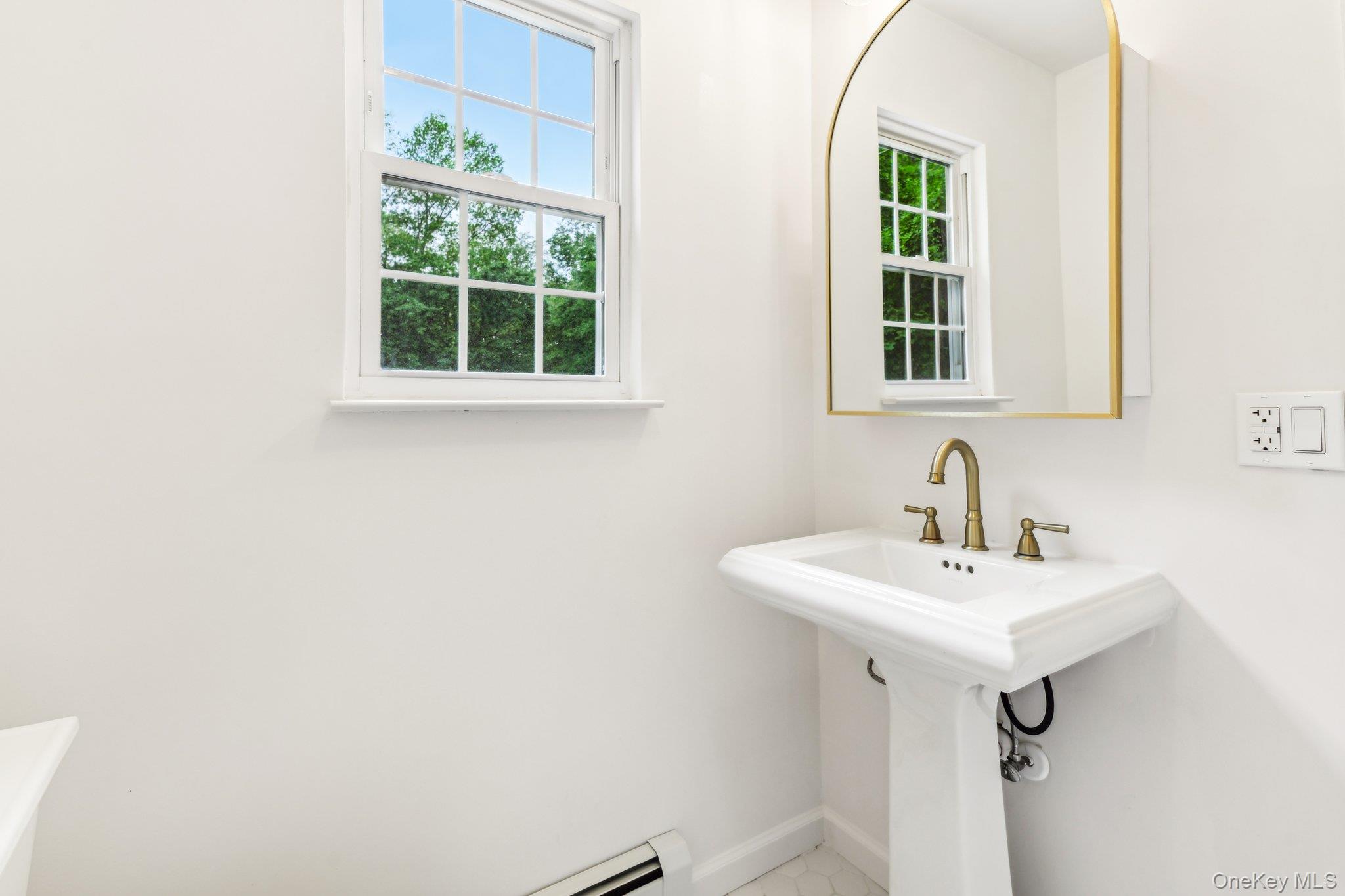 8 Mill Lot Road Middle Island, NY 11953 - Photo 13 of 20 a bathroom with a sink and a window