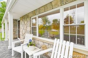 8 Mill Lot Road Middle Island, NY 11953 - Photo 17 of 20 a view of balcony with a large window and wooden floor