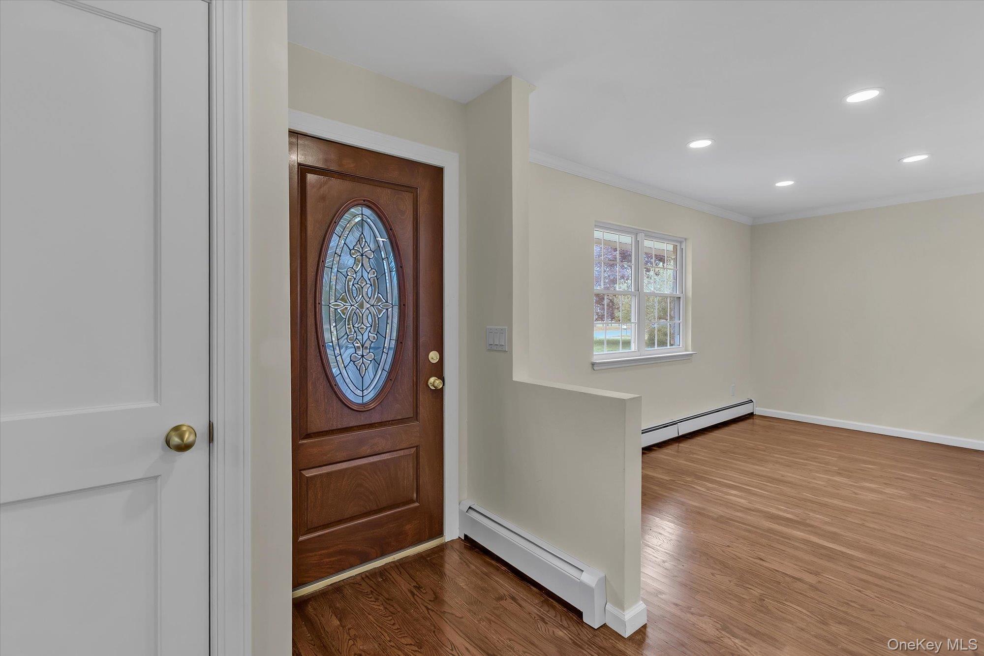 8 Mill Lot Road Middle Island, NY 11953 - Photo 18 of 20 a view of an entryway with wooden floor