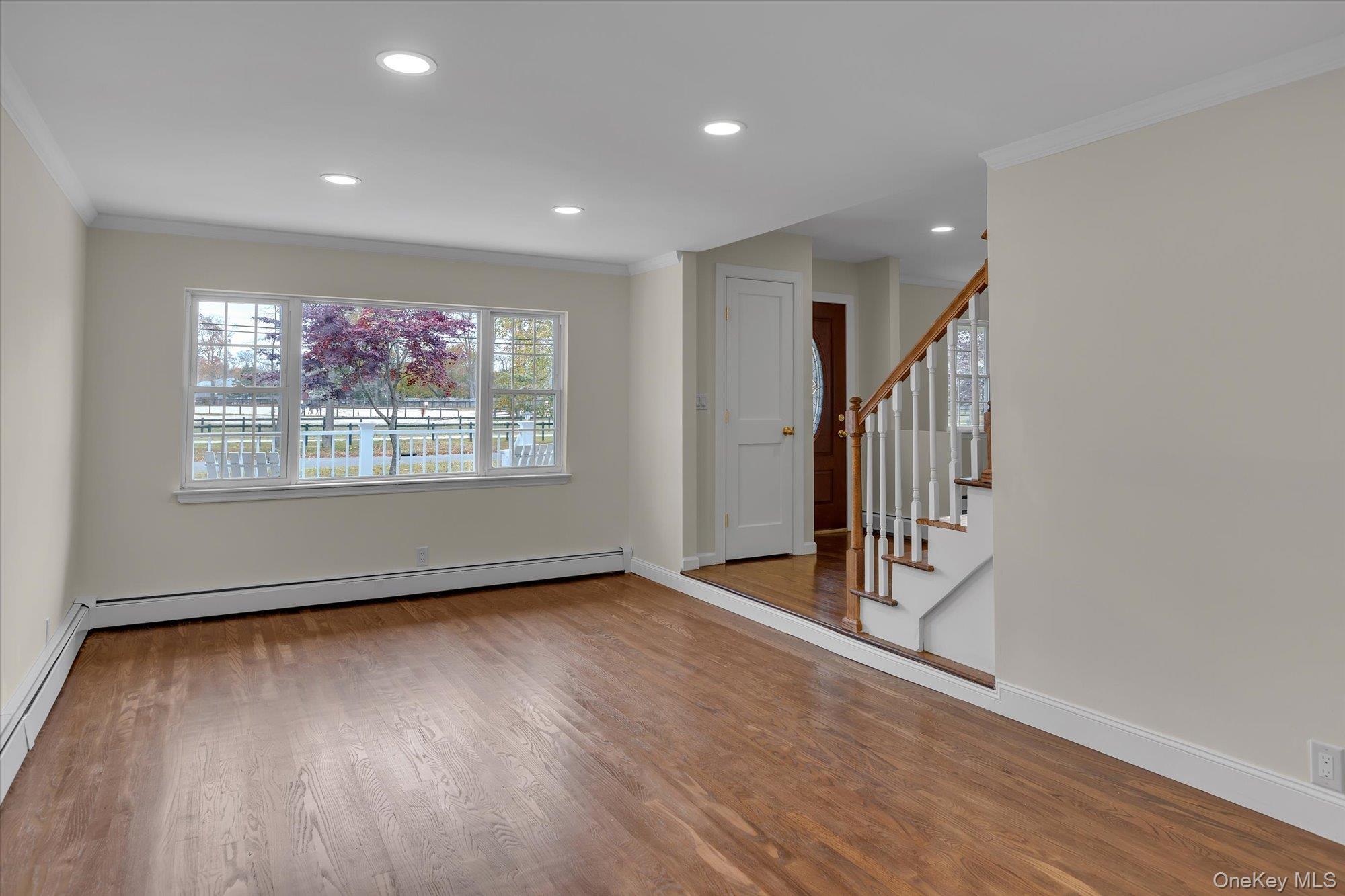 8 Mill Lot Road Middle Island, NY 11953 - Photo 19 of 20 wooden floor in an empty room with a window