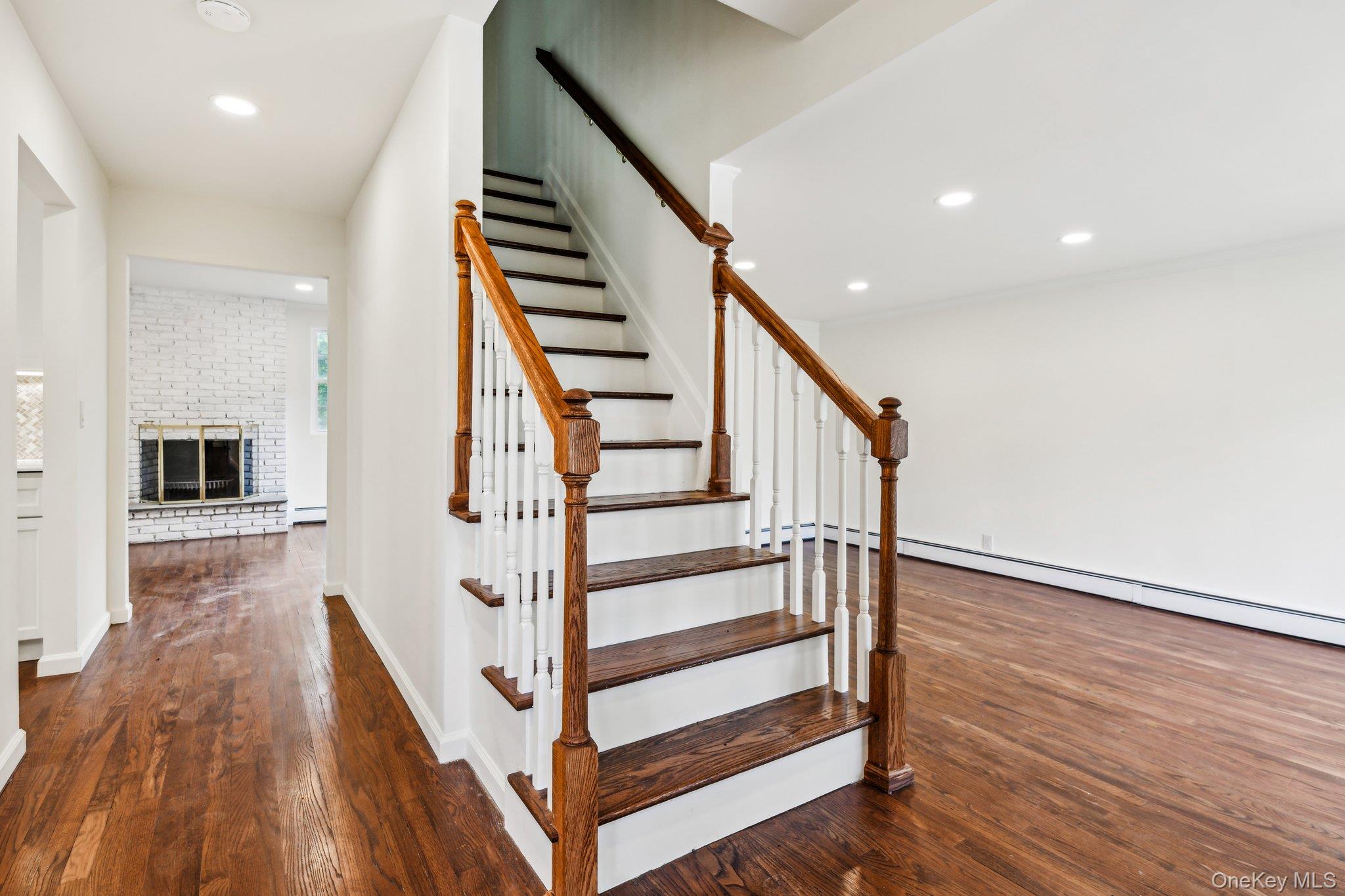 8 Mill Lot Road Middle Island, NY 11953 - Photo 5 of 20 a view of entryway with wooden floor and stairs