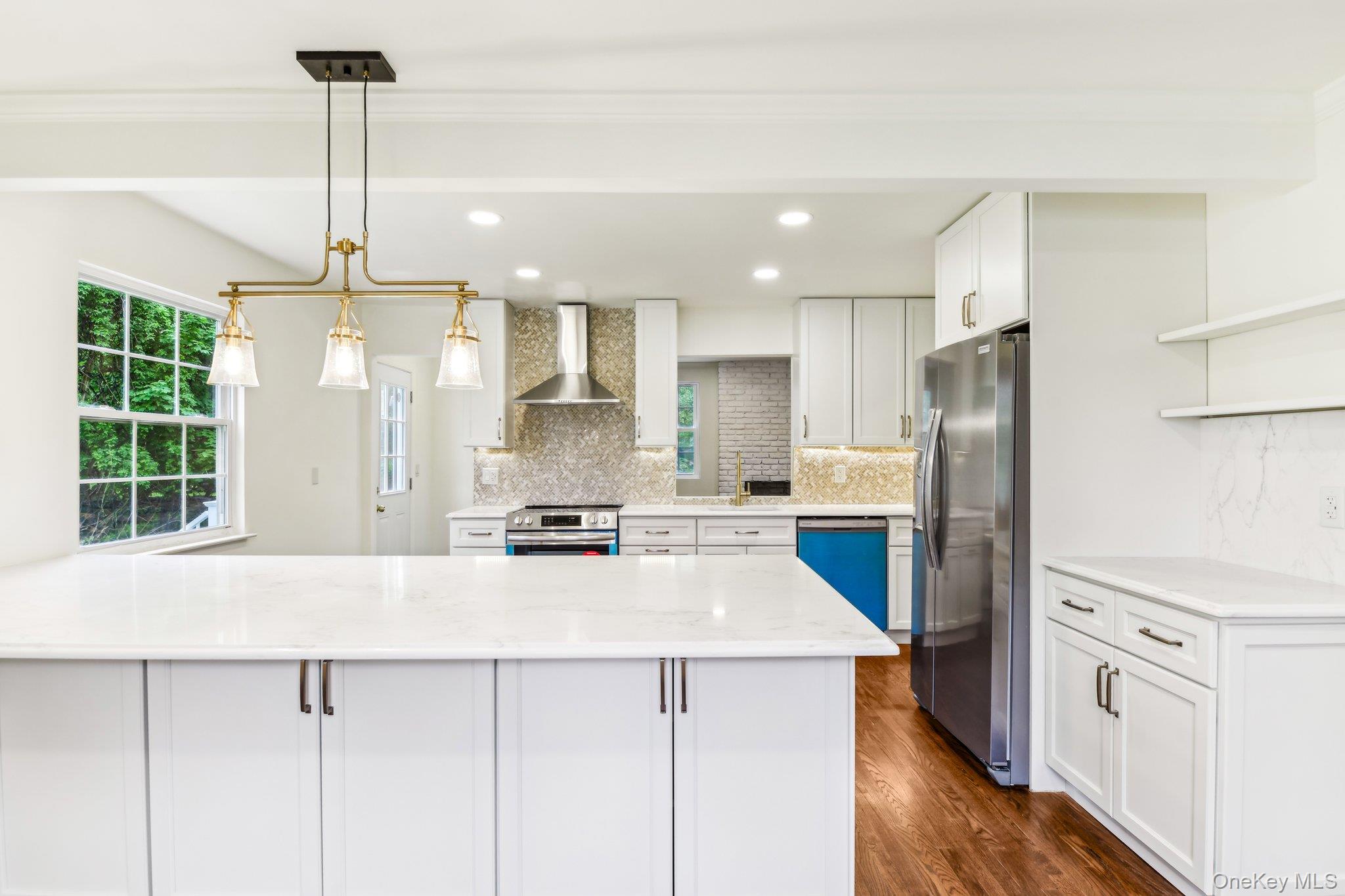 8 Mill Lot Road Middle Island, NY 11953 - Photo 6 of 20 a kitchen with stainless steel appliances a refrigerator sink and stove