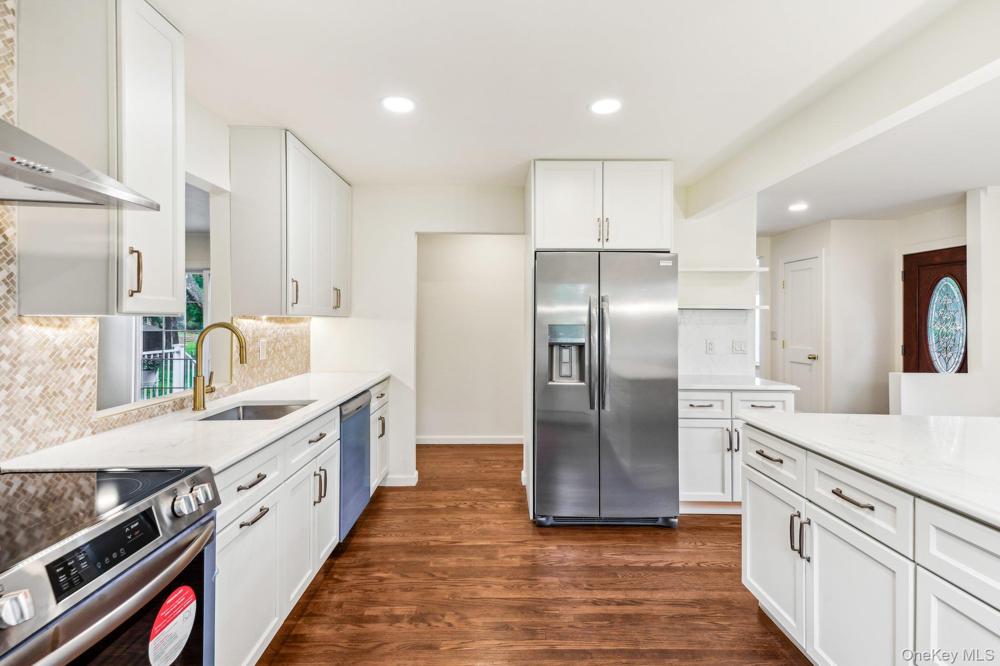 8 Mill Lot Road Middle Island, NY 11953 - Photo 8 of 20 a kitchen with stainless steel appliances granite countertop a refrigerator a sink and a stove