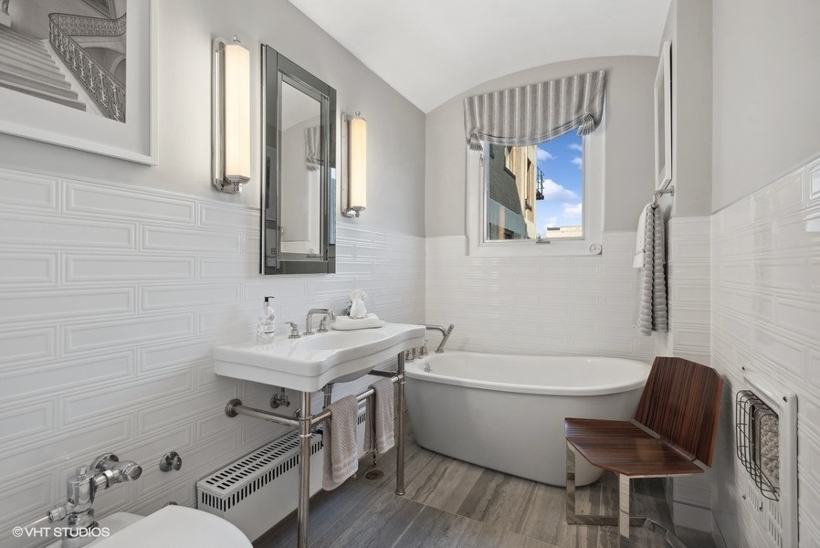 222 East Chestnut Street, Unit 17B Chicago, IL 60611 - Photo 19 of 29 a bathroom with a toilet a sink and a bathtub