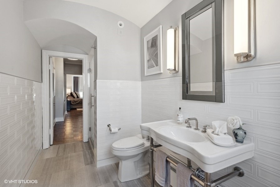 222 East Chestnut Street, Unit 17B Chicago, IL 60611 - Photo 20 of 29 a bathroom with a sink toilet and shower