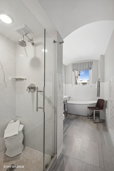 222 East Chestnut Street, Unit 17B Chicago, IL 60611 - Photo 21 of 29 a room with a couch and a window