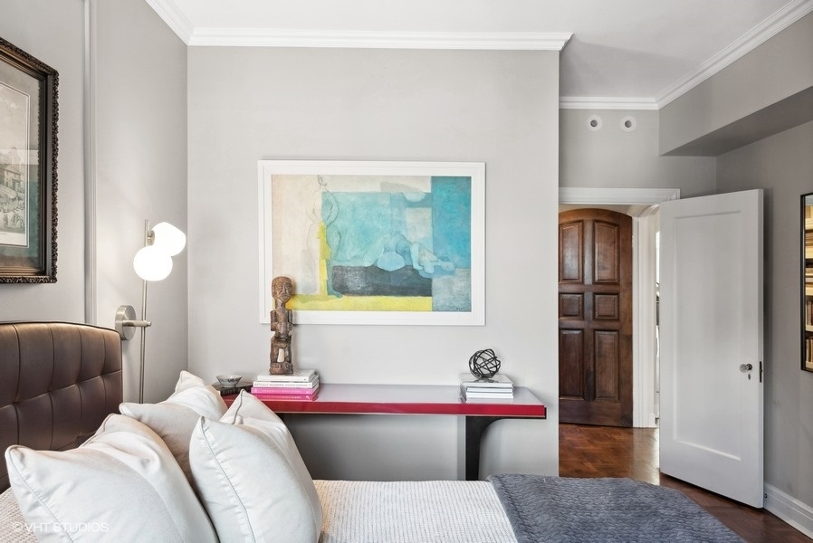 222 East Chestnut Street, Unit 17B Chicago, IL 60611 - Photo 24 of 29 a living room with a couch and dresser