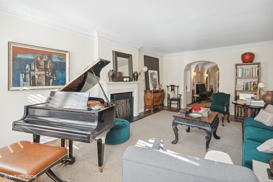 222 East Chestnut Street, Unit 17B Chicago, IL 60611 - Photo 3 of 29 a living room with furniture a rug and white walls