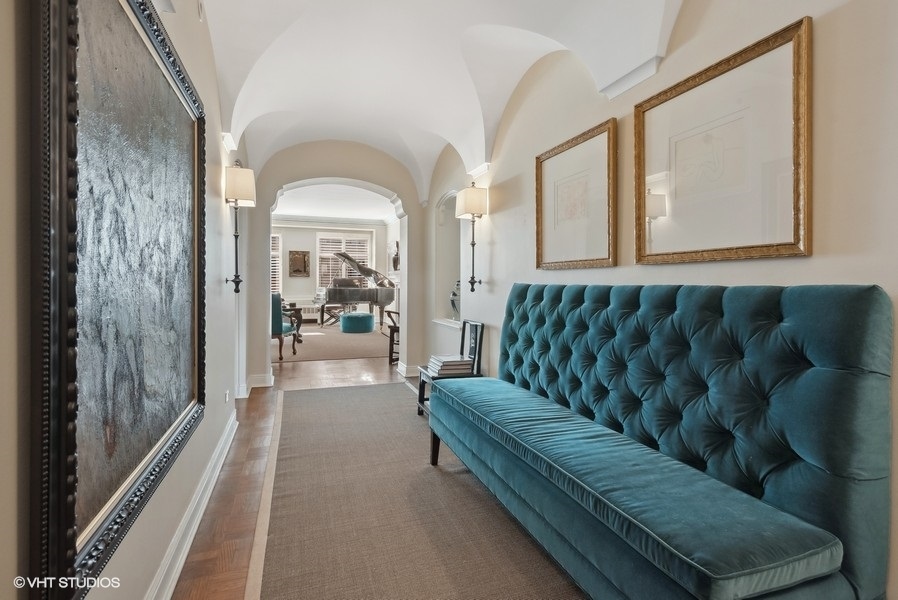 222 East Chestnut Street, Unit 17B Chicago, IL 60611 - Photo 7 of 29 a living room with a couch and a large window