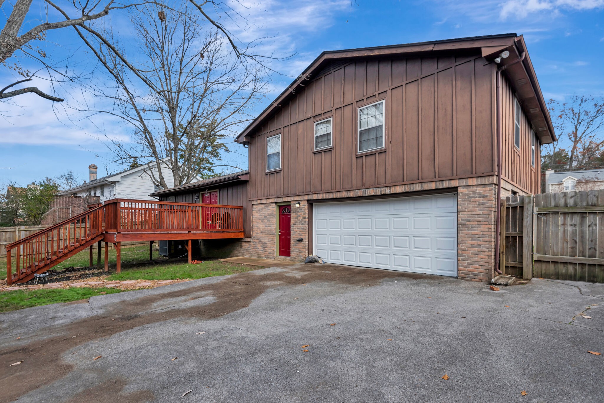 561 Castlegate Drive Nashville, TN 37217 - Photo 20 of 21 a front view of a house with a yard and garage