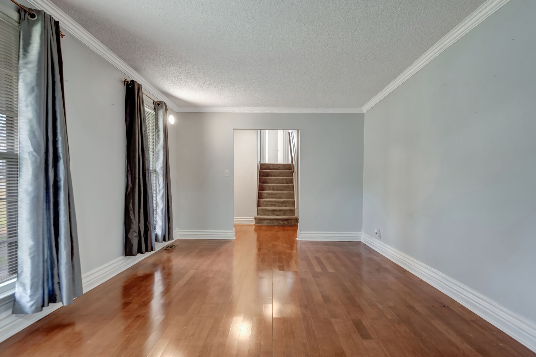 561 Castlegate Drive Nashville, TN 37217 - Photo 2 of 21 a view of an empty room with wooden floor and a window