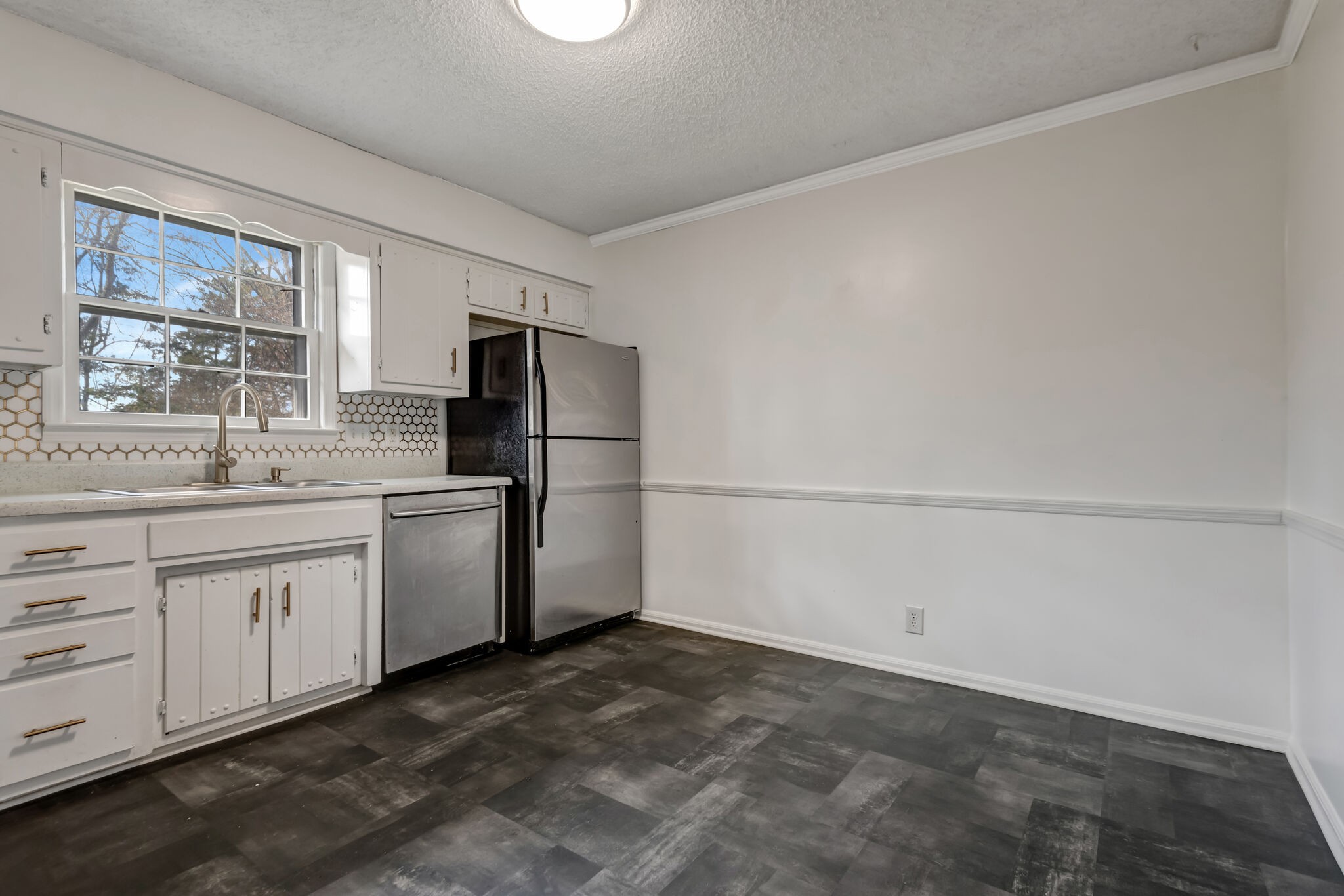 561 Castlegate Drive Nashville, TN 37217 - Photo 6 of 21 a kitchen with white cabinets and refrigerator