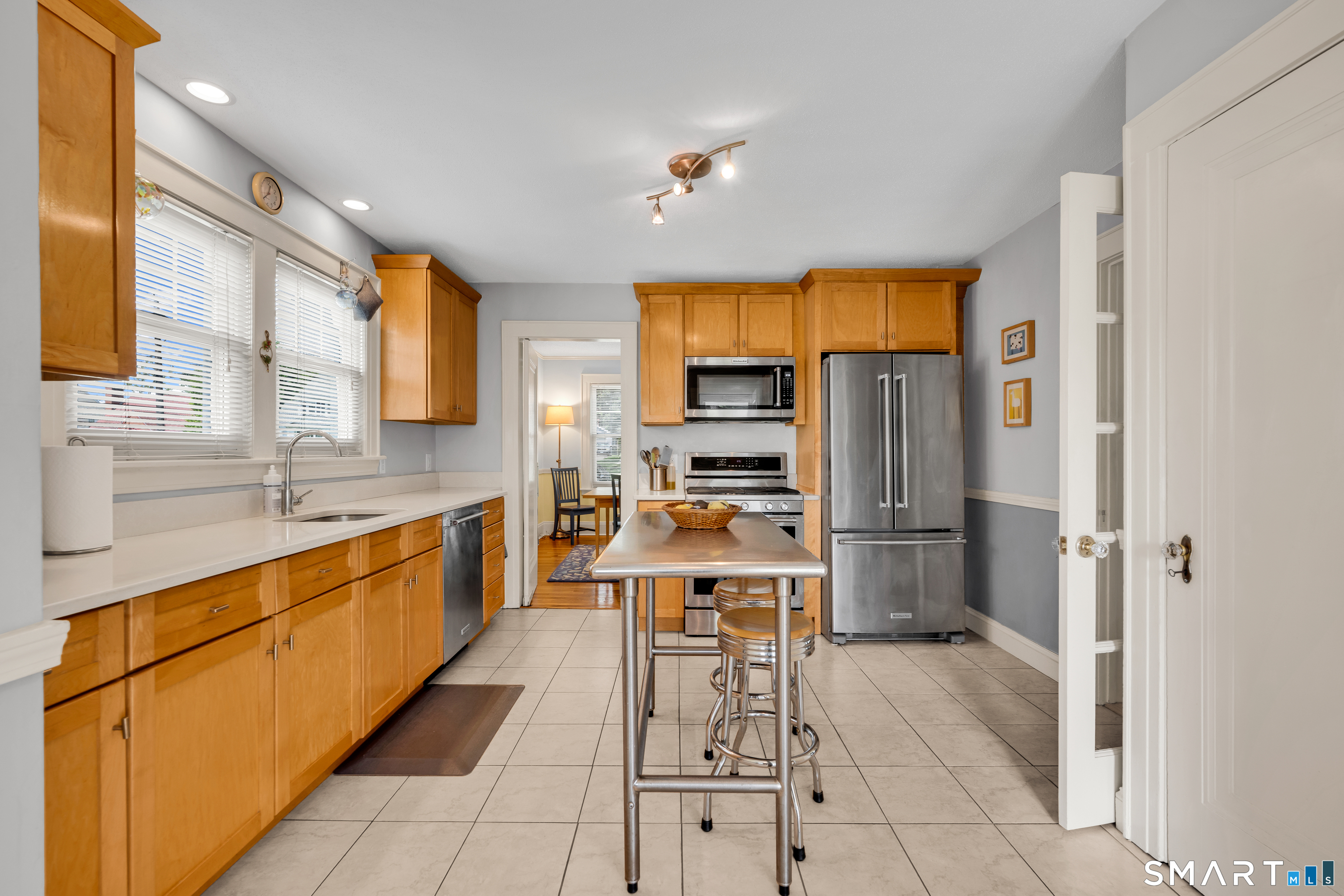 44 Beverly Road Wethersfield, CT 06109 - Photo 7 of 31 a large kitchen with stainless steel appliances kitchen island granite countertop a refrigerator and a sink