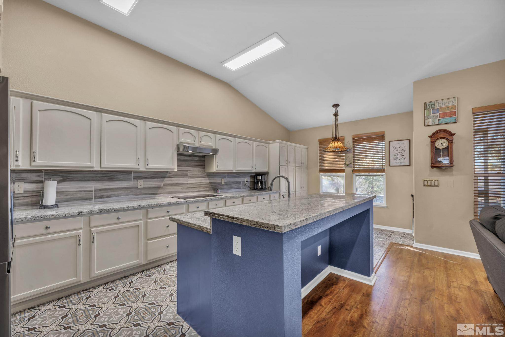 4805 Crestside Drive Sparks, NV 89436 - Photo 13 of 33 a kitchen with stainless steel appliances granite countertop a sink stove and cabinets