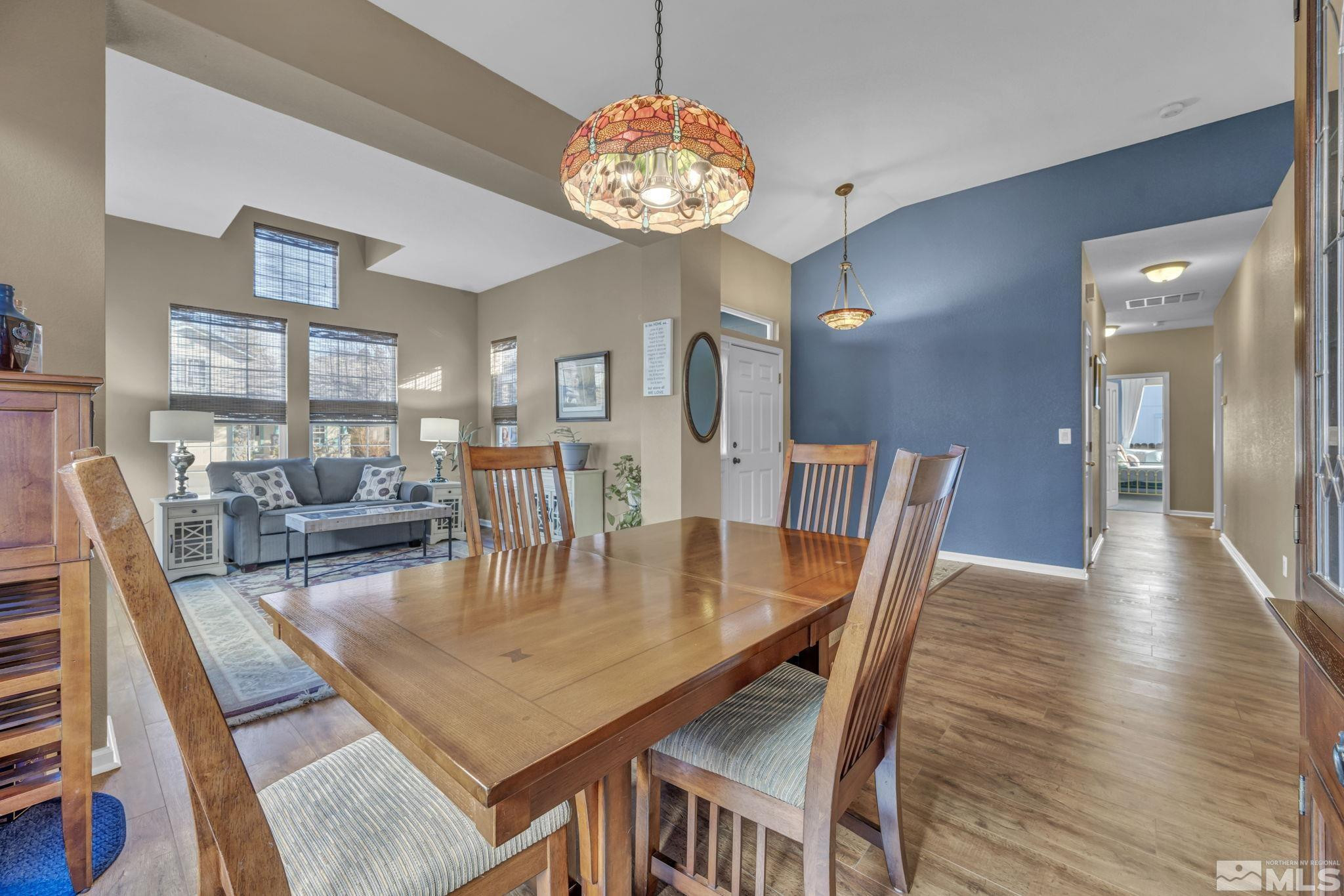 4805 Crestside Drive Sparks, NV 89436 - Photo 8 of 33 a view of a dining room with furniture and wooden floor