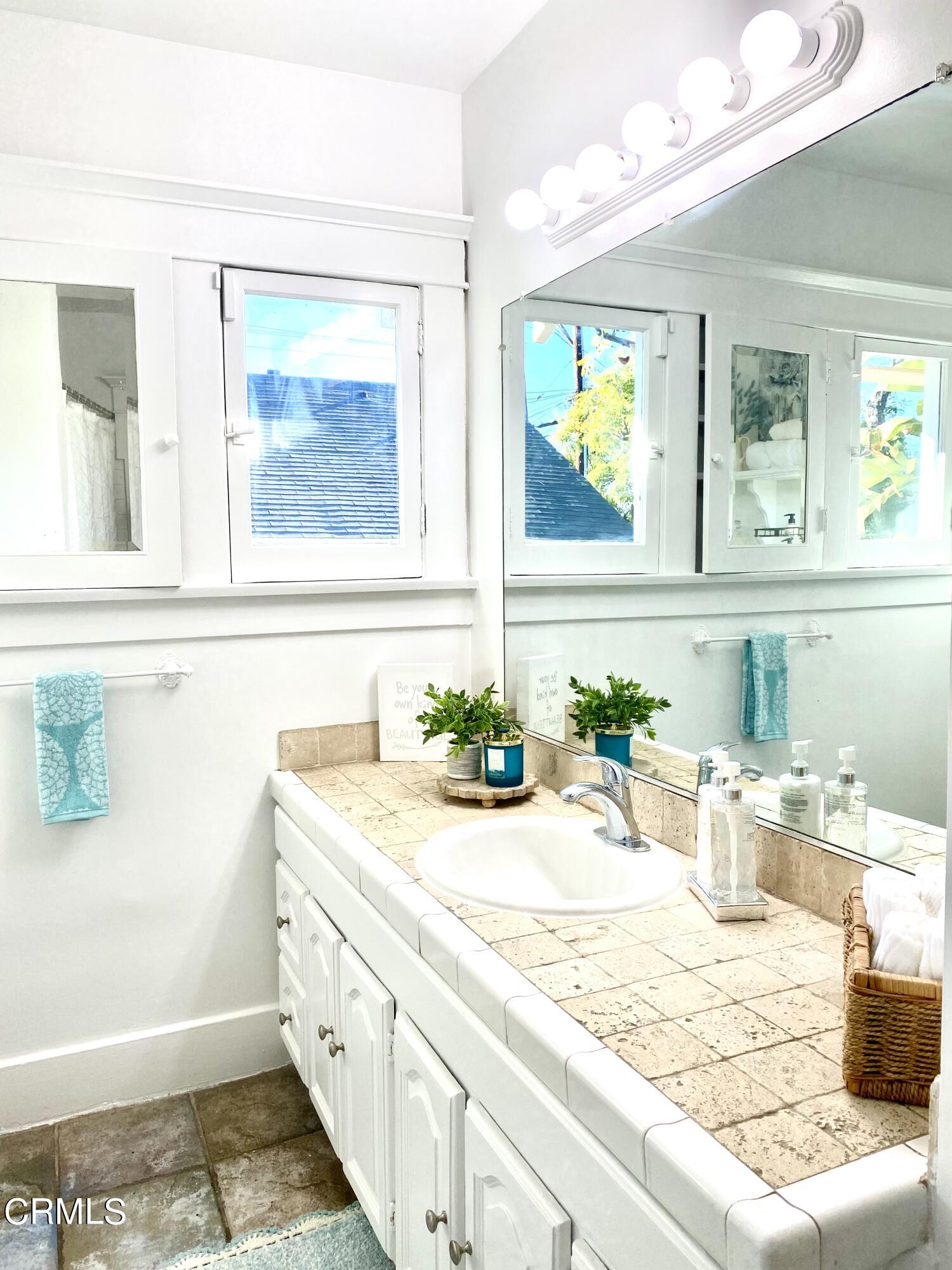 1741 Mission Street South Pasadena, CA 91030 - Photo 26 of 51 a bathroom with a granite countertop sink and a window