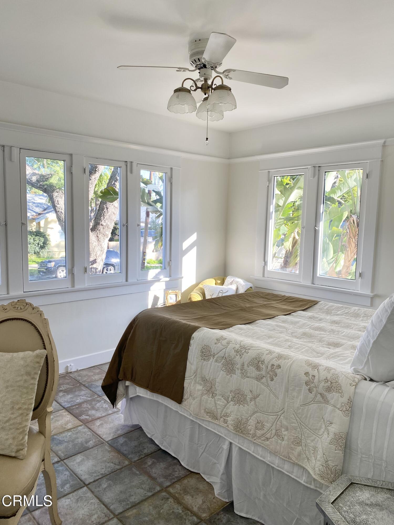 1741 Mission Street South Pasadena, CA 91030 - Photo 27 of 51 a living room with a bed furniture and a large window