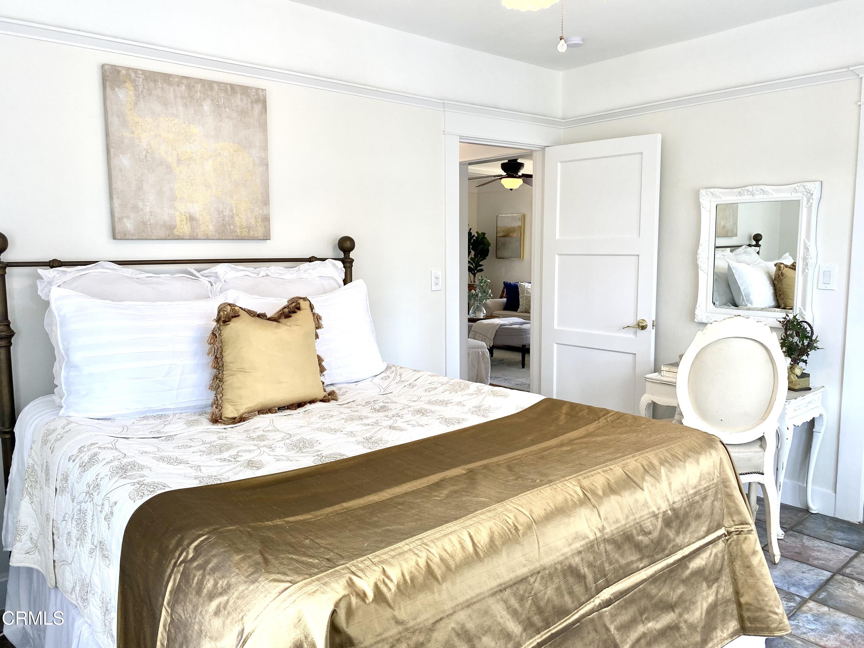 1741 Mission Street South Pasadena, CA 91030 - Photo 29 of 51 a bedroom with a bed and painting on the wall