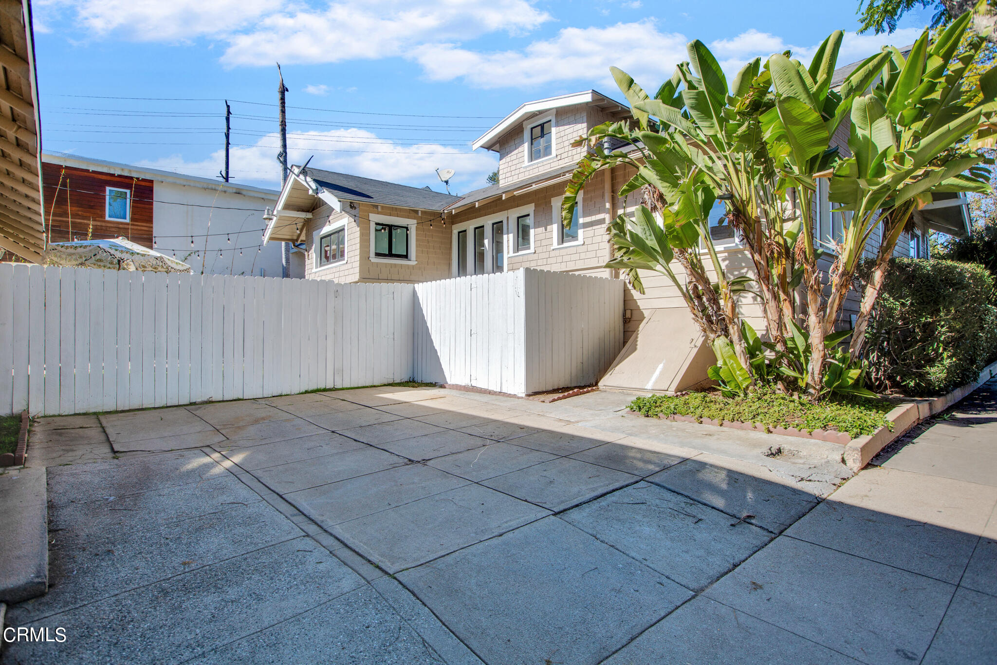 1741 Mission Street South Pasadena, CA 91030 - Photo 41 of 51 a view of a white house with a fountain and potted plants