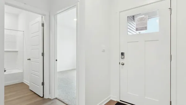 a view of a bathroom from the hallway