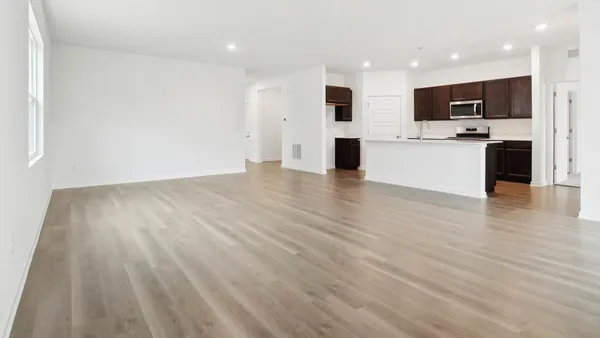 a view of kitchen with microwave and cabinets