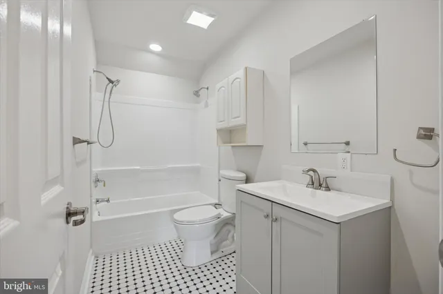 a bathroom with a sink toilet a shower and a mirror