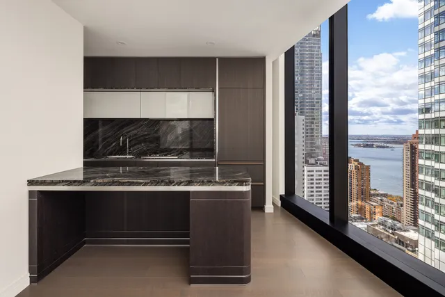 a view of an empty room with windows