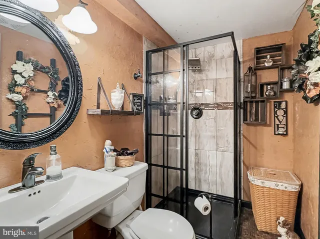 a bedroom with a bed and ceiling fan