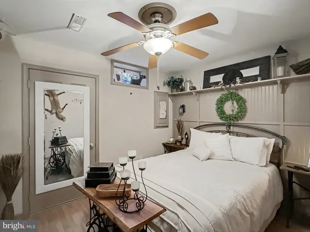 a view of a workspace with furniture and a bedroom