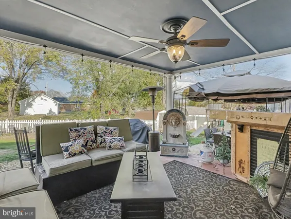 a balcony with wooden floor and fence