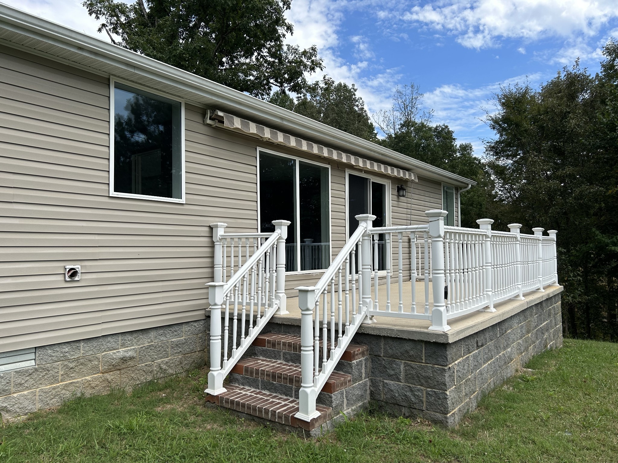 1762 Walden Ridge Road Manchester, TN 37355 - Photo 11 of 12 a view of a house with wooden deck and a yard