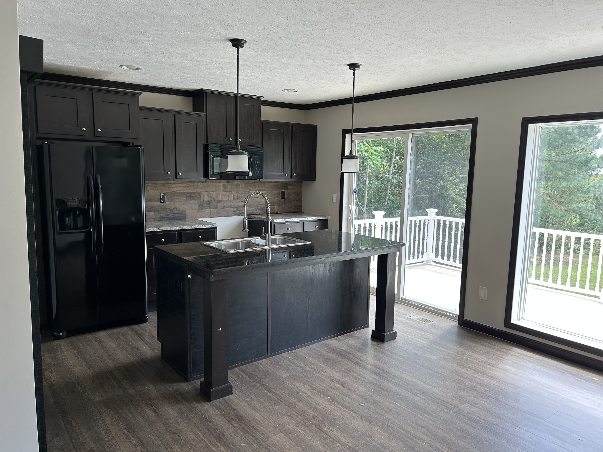 1762 Walden Ridge Road Manchester, TN 37355 - Photo 3 of 12 a kitchen with kitchen island granite countertop a refrigerator stove top oven and sink