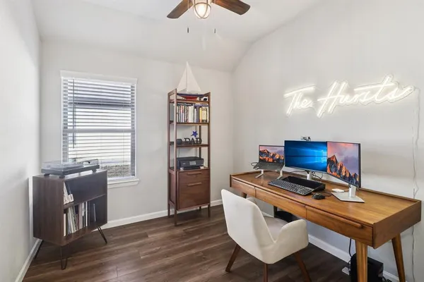a room with furniture and a bookshelf