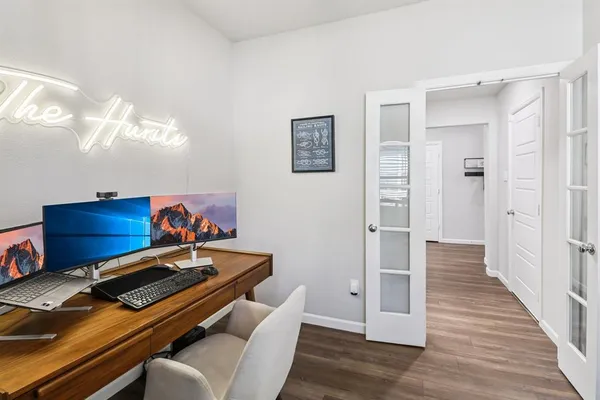 a room with furniture and wooden floor