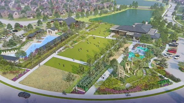 an aerial view of a residential houses with outdoor space