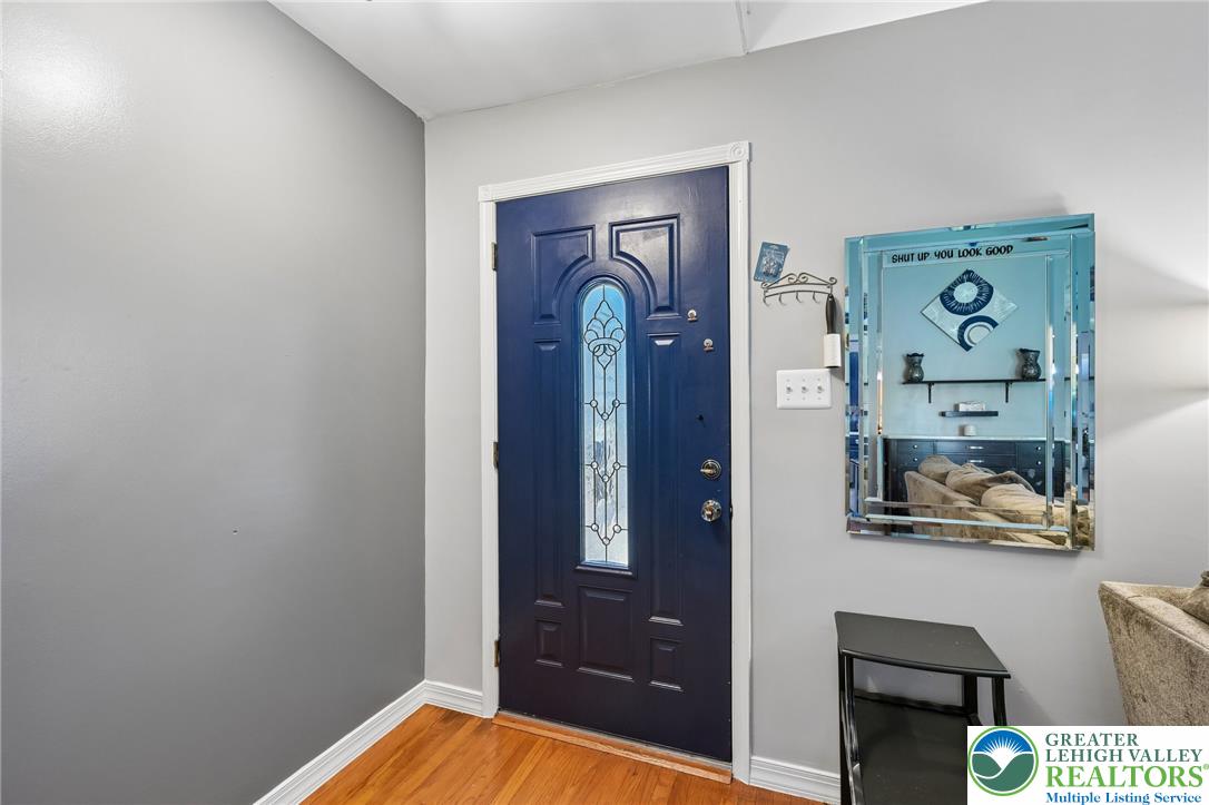 2649 Nottingham Road Bethlehem, PA 18017 - Photo 4 of 49 Enter through a distinctive front door with an ornate glass panel, highlighting the welcoming entrance.