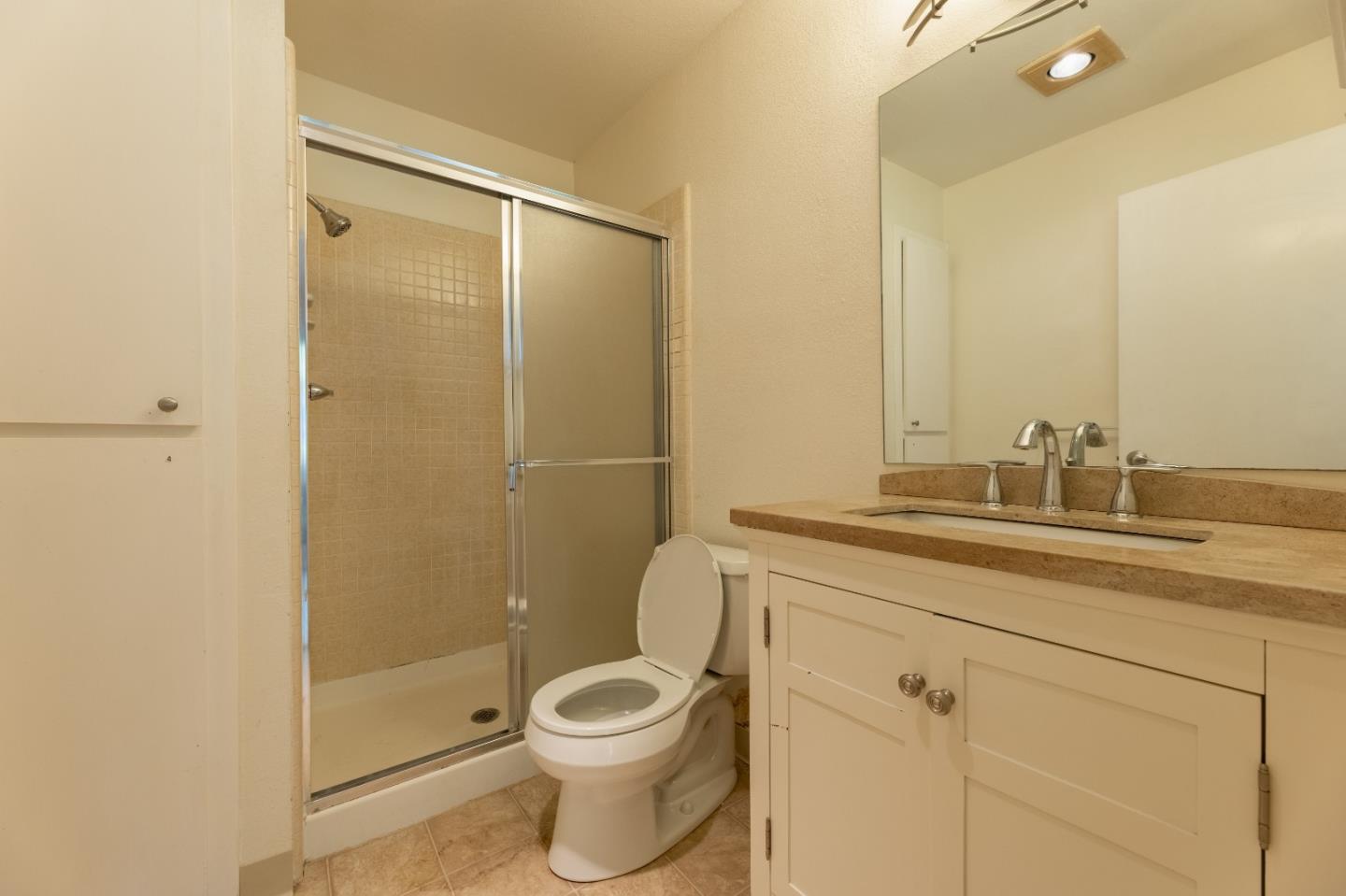 1055 North Capitol Avenue, Unit 51 San Jose, CA 95133 - Photo 11 of 23 a bathroom with a toilet a sink and shower