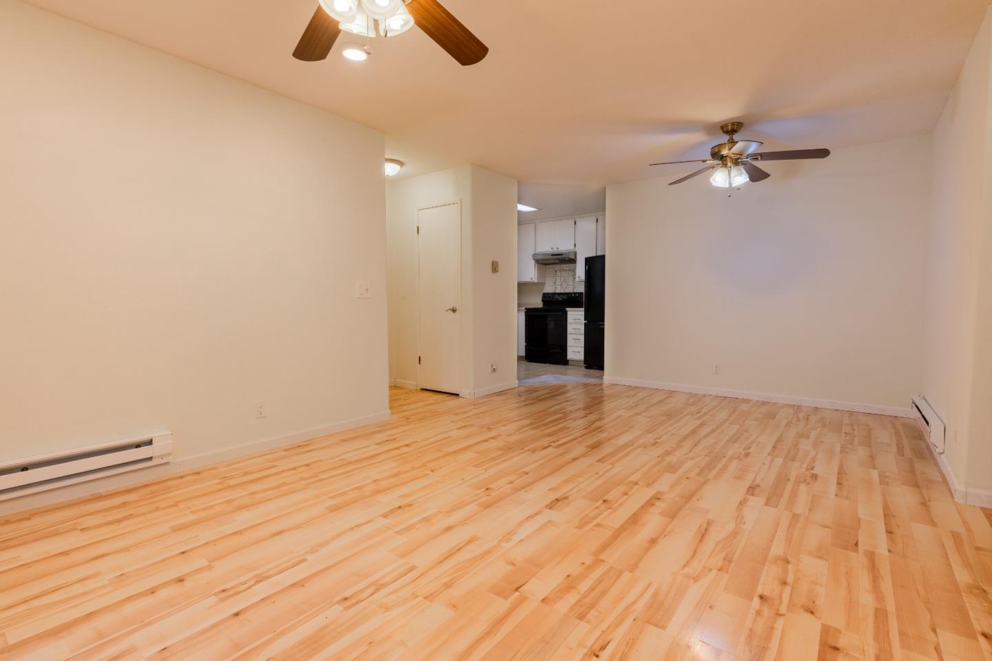 1055 North Capitol Avenue, Unit 51 San Jose, CA 95133 - Photo 14 of 23 a view of empty room with wooden floor and fan