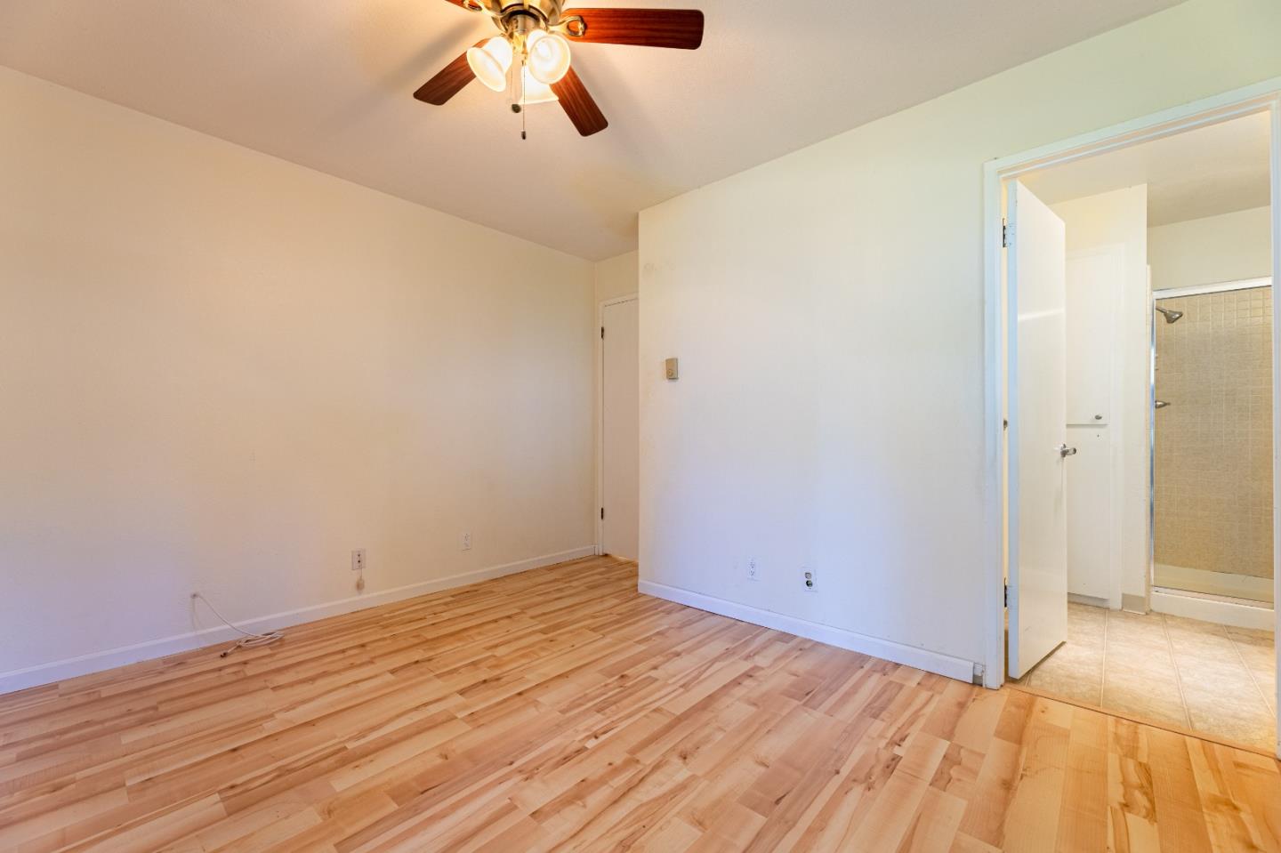 1055 North Capitol Avenue, Unit 51 San Jose, CA 95133 - Photo 16 of 23 a view of a room with wooden floor and ceiling fan
