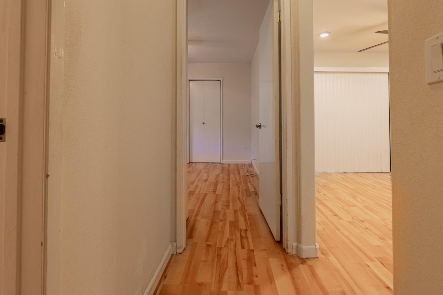 1055 North Capitol Avenue, Unit 51 San Jose, CA 95133 - Photo 17 of 23 a view of a hallway with wooden floor