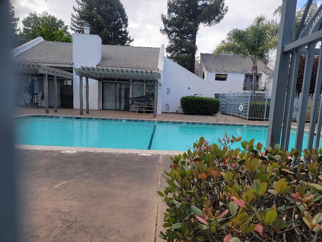 1055 North Capitol Avenue, Unit 51 San Jose, CA 95133 - Photo 7 of 23 a front view of a house with garden