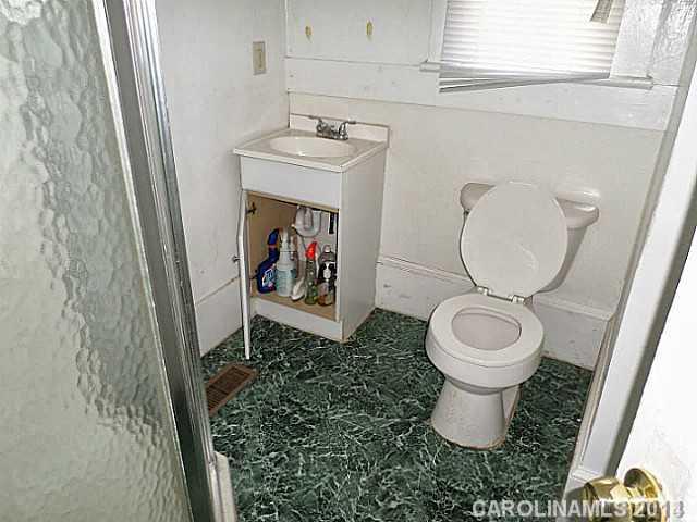1705 Beatties Ford Road Charlotte, NC 28216 - Photo 6 of 6 a bathroom with a toilet and a sink